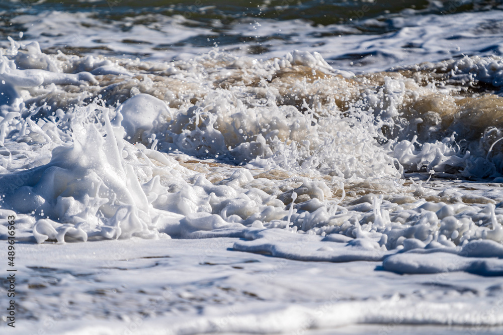 Waves Broken On Beach With White Sea Foam
