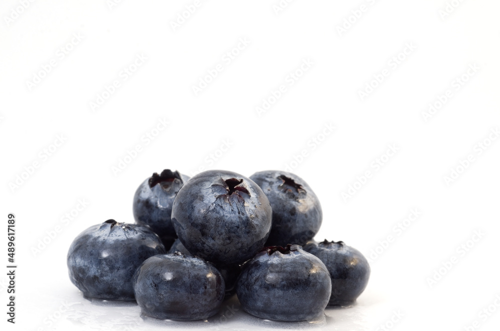 Macro Image of Delicious Wet Blueberries Isolated on White Background Macro Image of Delicious Wet Blueberries Isolated on White Background