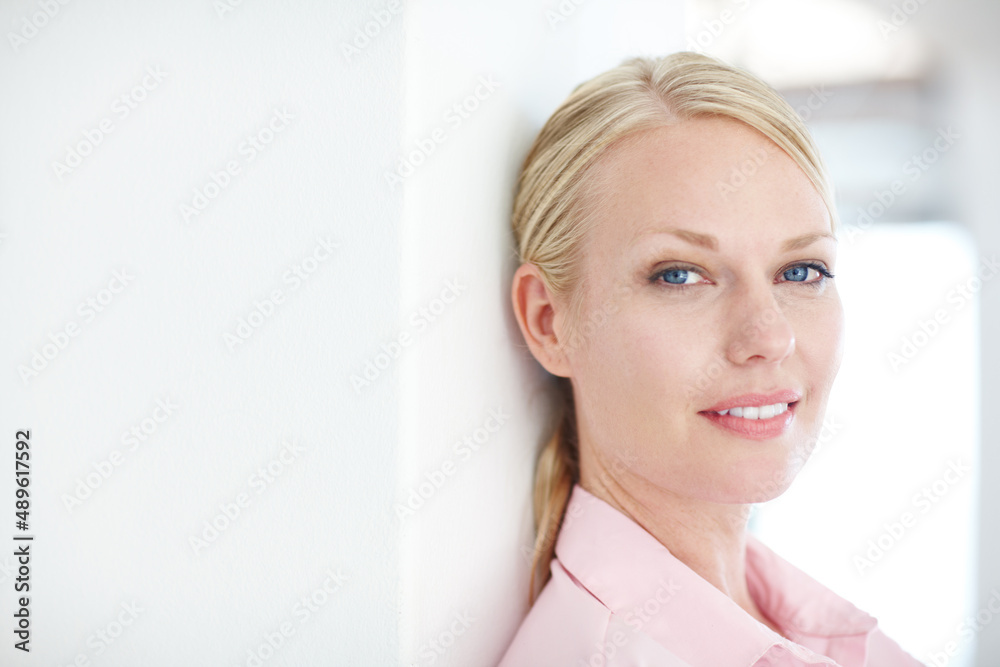 Entrepreneurship - the rewards far outweigh the risks. Closeup shot of an attractive young businesswoman leaning against a wall. Entrepreneurship - the rewards far outweigh the risks. Closeup shot of an attractive young businesswoman leaning against a wall.