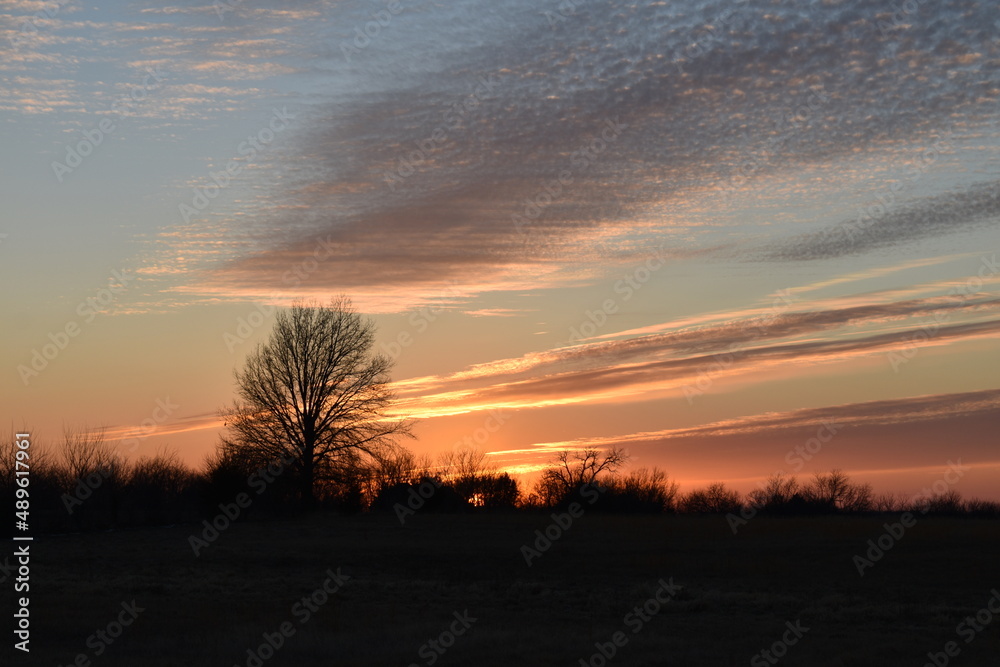Dramatic Sunset Over a Rural Field Dramatic Sunset Over a Rural Field