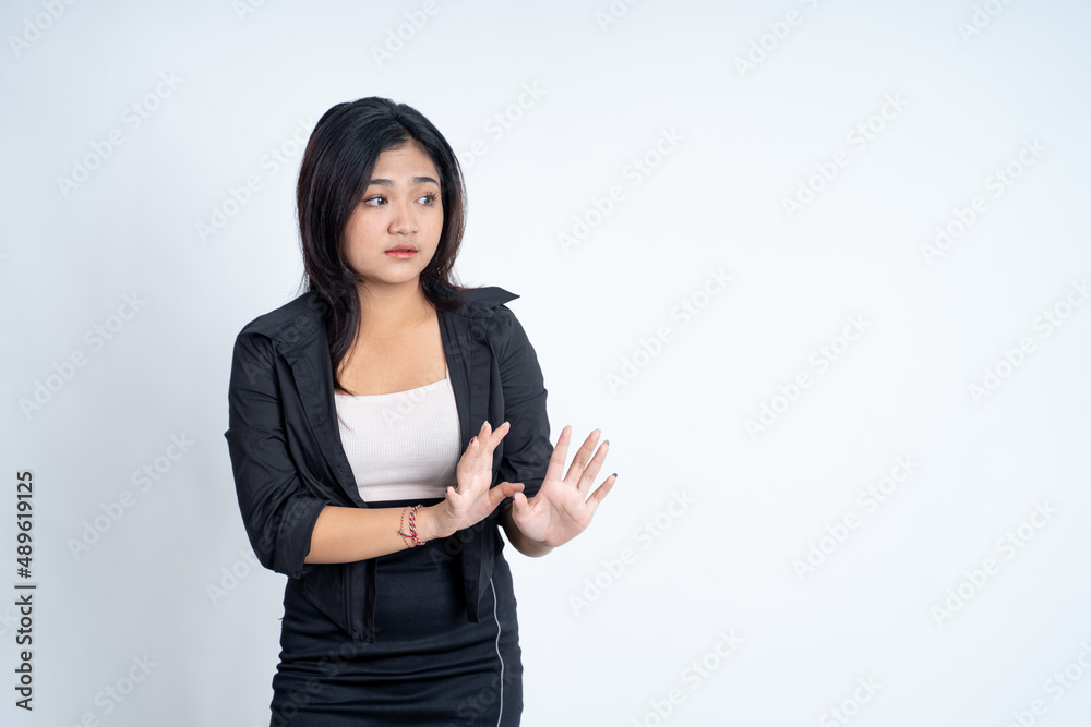 Young woman refusing with both palms gesture side a copyspace Young woman refusing with both palms gesture side a copyspace