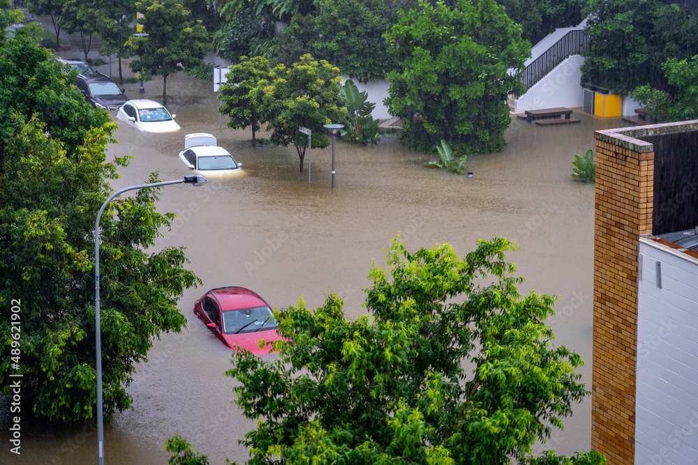 Roads flooded and cars under water after the heavy rain in West End, Brisbane, Australia  - obrazy, fototapety, plakaty 