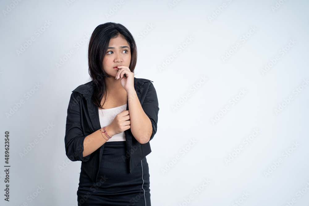 Young asian woman worried with bite finger gesture Young asian woman worried with bite finger gesture