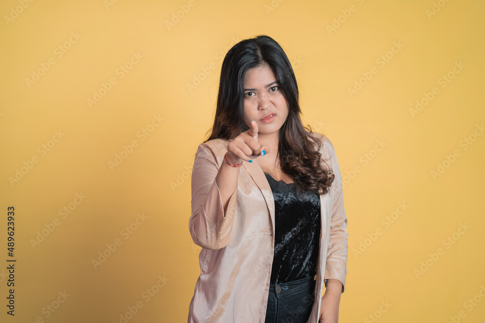 asian young woman with finger pointing hand gesture asian young woman with finger pointing hand gesture