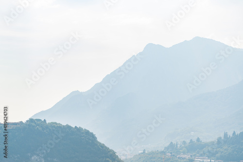 Panoramic blurred mountain landscape near Como lake in Italy, summer