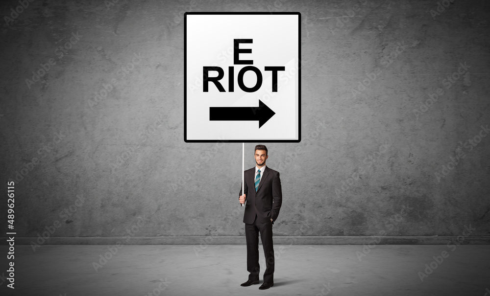 business person holding a traffic sign business person holding a traffic sign