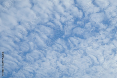 On a bright sunny afternoon sky. Altocumulus Clouds. Great for background  wallpaper or as backdrop.