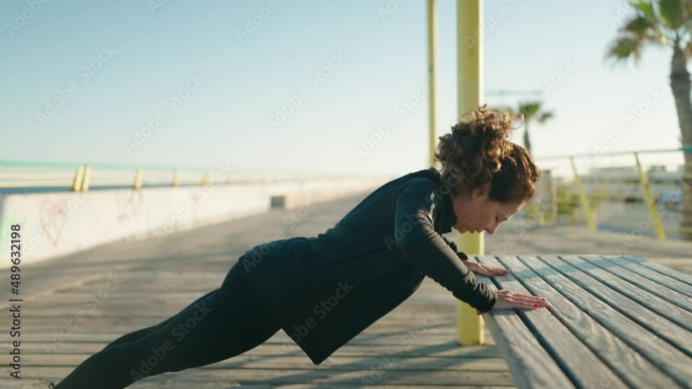 Middle age woman wearing sportswear training at street