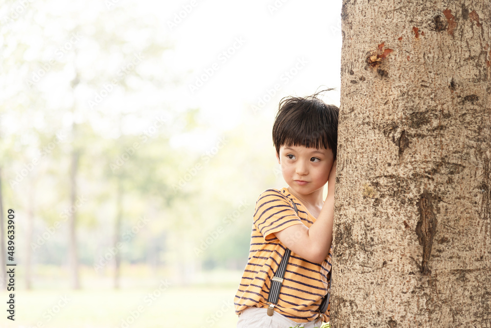 Young little boy stands alone on sunset time. Silhouette of boy, concept of lonely, sad, and scared. Young little boy stands alone on sunset time. Silhouette of boy, concept of lonely, sad, and scared.