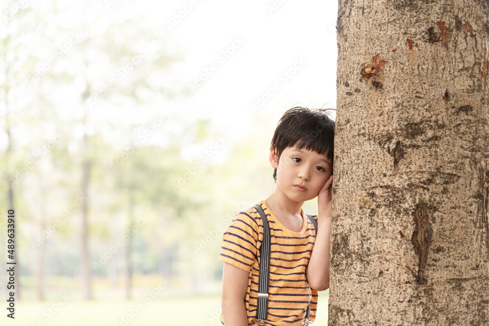 Young little boy stands alone on sunset time. Silhouette of boy, concept of lonely, sad, and scared. Young little boy stands alone on sunset time. Silhouette of boy, concept of lonely, sad, and scared.