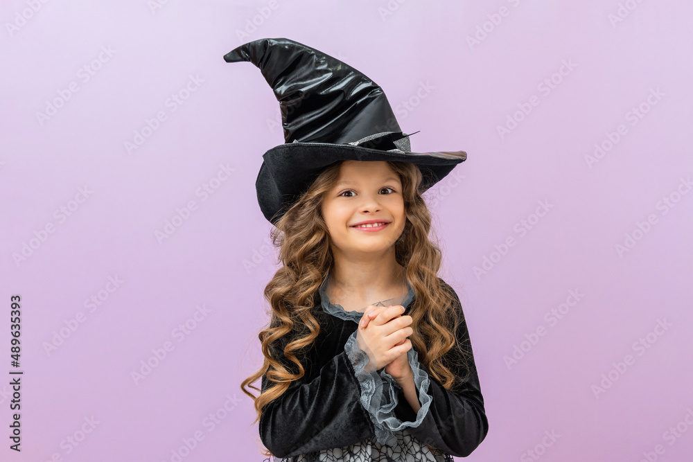 A girl in a carnival witch costume. A witch's costume for halloween. A little girl in a fairy costume. A girl in a carnival witch costume. A witch's costume for halloween. A little girl in a fairy costume.
