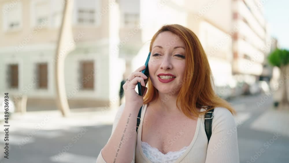 Young redhead woman with doubt expression standing at street Young redhead woman with doubt expression standing at street