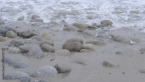 Waves washing on the rocks on the beach
