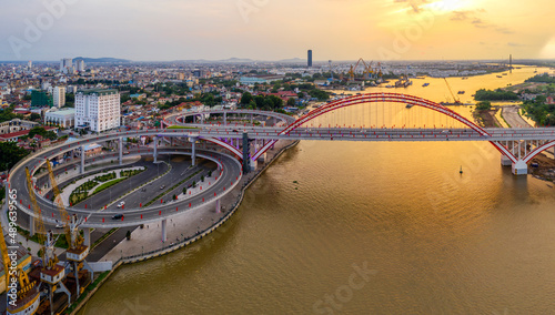 Hai Phong, Vietnam Aug 2020 Aerial view of a bridge from 300m above during sunset
