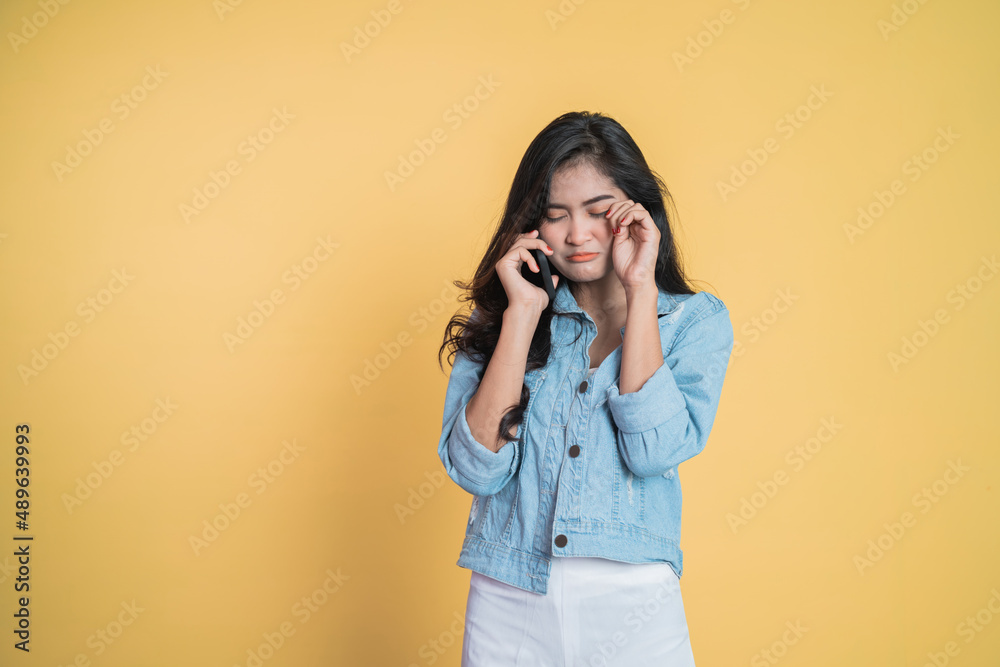 woman making a call when she hears bad news
