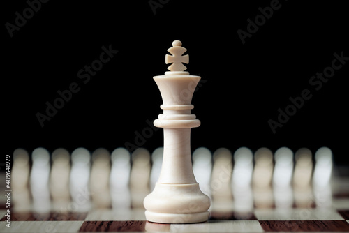 King in battle chess game stand on board game , leadership and business vision for a win in business , Business leadership concept