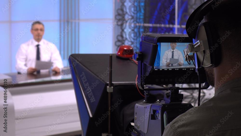 News anchor in the studio, live. A charismatic white man discussing daily events . News anchor in the studio, live. A charismatic white man discussing daily events .
