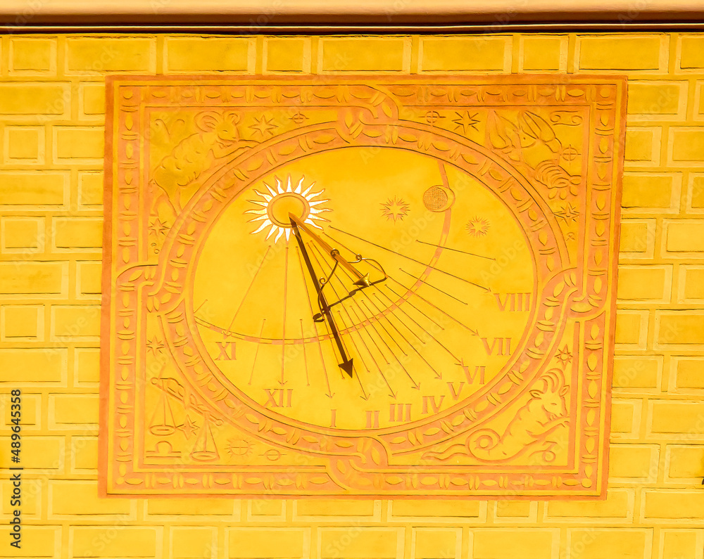  Sun clock located at building in Old town in Warsaw, Poland.