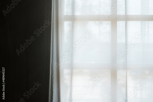 Transparent curtain on window.