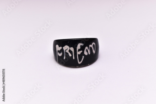 Black and white color friendship ring closeup shot on the occasion of friendship day on white background