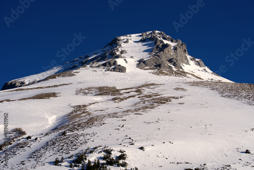 Aerial view of mountain panorama at the Swiss Alps seen from ski resort Engelberg, focus on background. Photo taken February 9th, 2022, Engelberg, Switzerland. photo