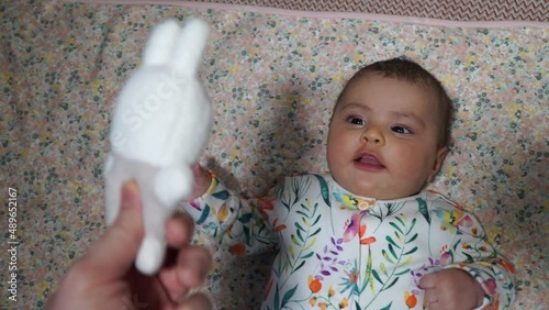 First toy. Little girl playing with a toy. 4K