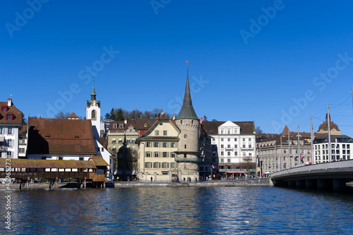 Cityscape of medieval old town of Luzern with river Reuss on a sunny winter day. Photo taken February 9th, 2022, Lucerne, Switzerland.