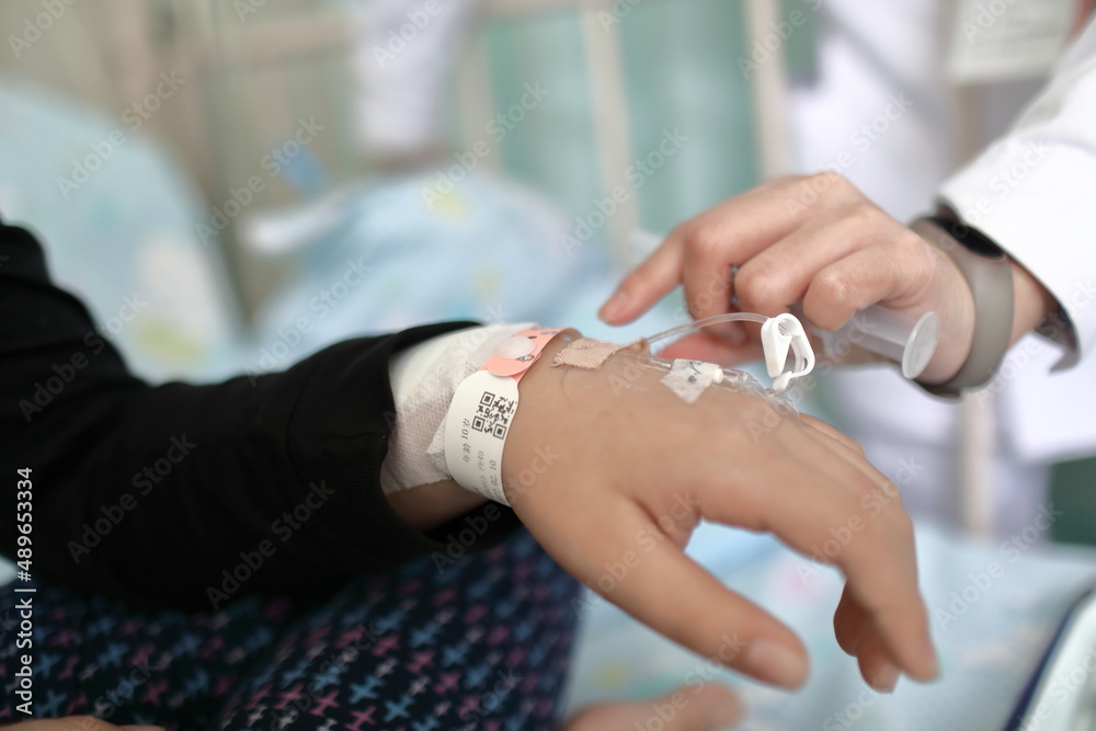 little boy with vaccine in hospital bed