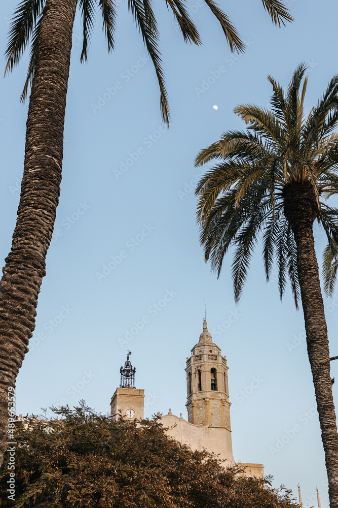 Old church and palm trees in Sitges, Spain