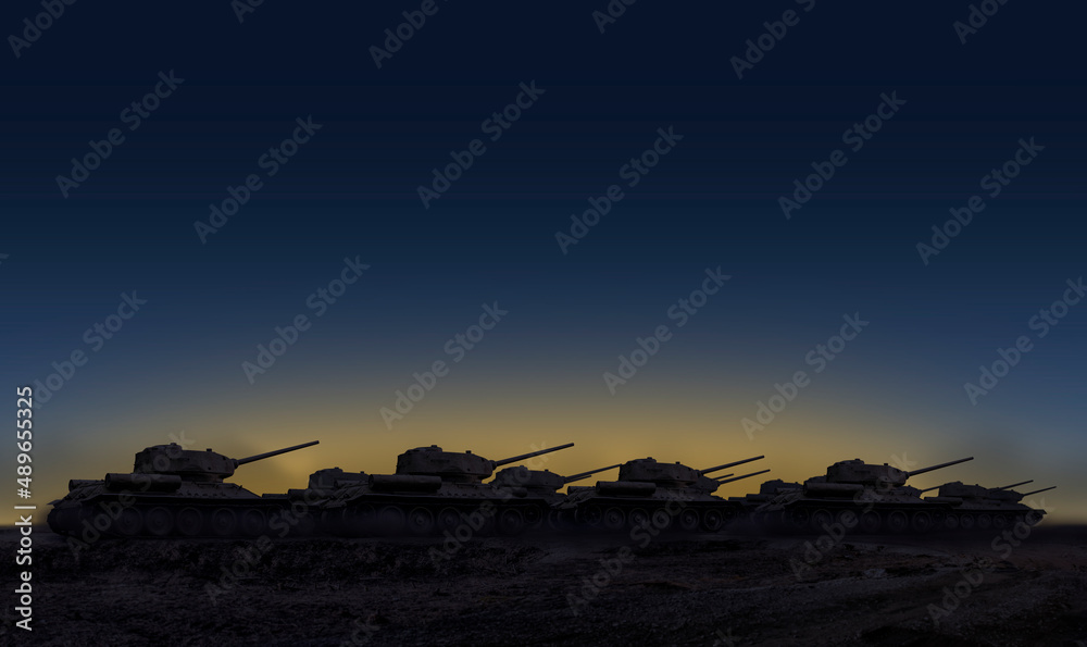 A group of tanks riding in the evening during sunset with yellow blue Ukrainian flag color sky in the background with copy space and , the first row of tanks being in focus
