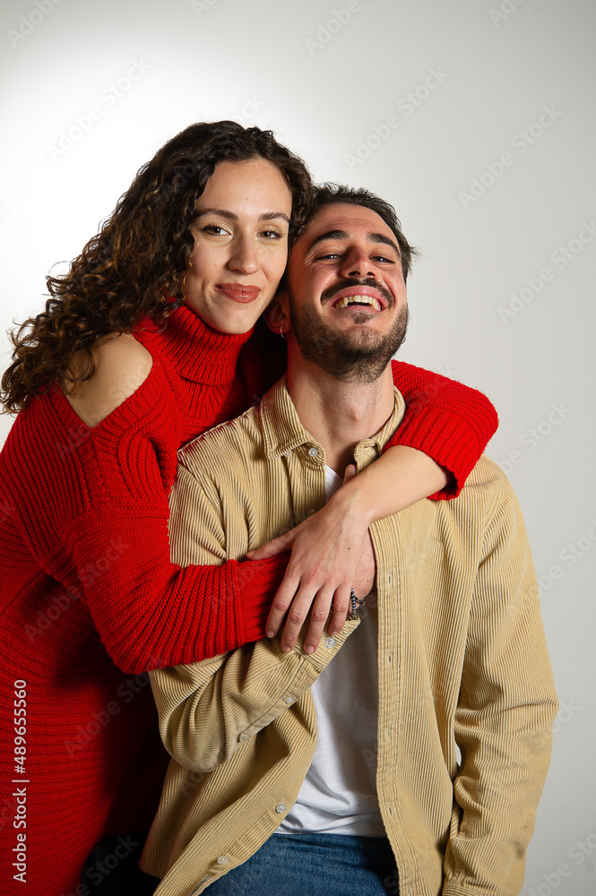 woman hugging her partner from behind woman hugging her partner from behind