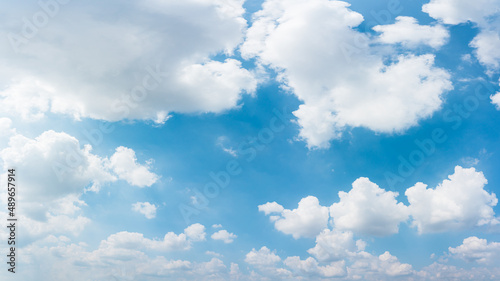 Blue sky and clouds with sun and daylight natural background.