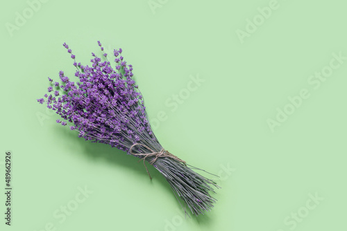 Purple lavender for print design on green paper background. Vintage floral card.