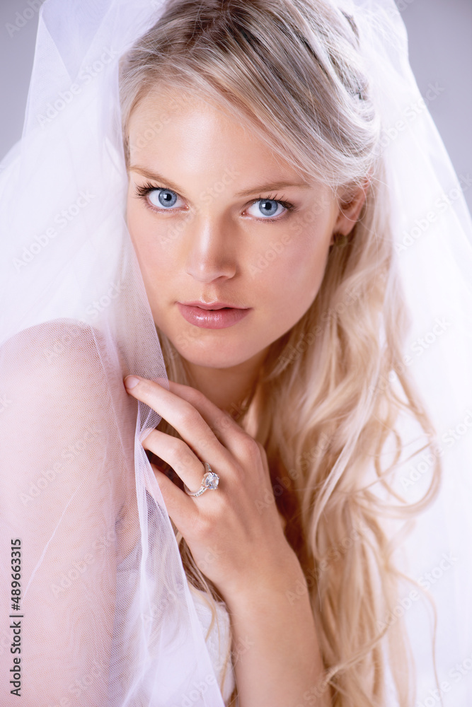 Bridal beauty. Closeup portrait of a beautiful young bride wearing a veil and wedding ring. Bridal beauty. Closeup portrait of a beautiful young bride wearing a veil and wedding ring.