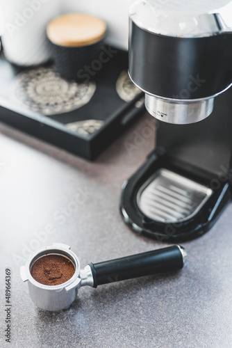 coffee machine pouring double espresso shot in clear coffee glass, coffee break at home