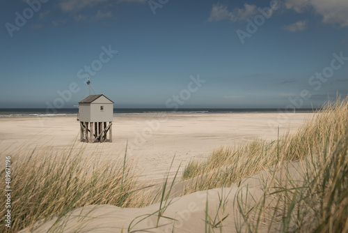 Wooden beach shelter hut on the shore in dunes of Dutch island Terschelling photo