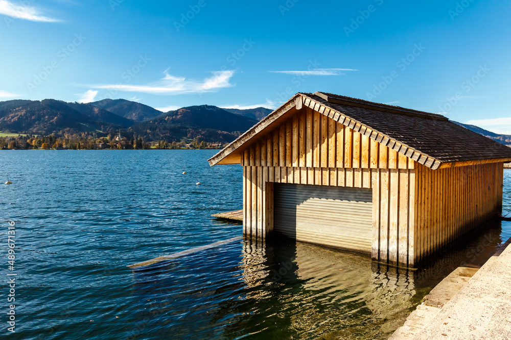 Old wooden boathouse at high tide