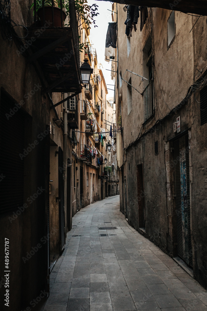 Old narrow street in Barcelona, Spain.