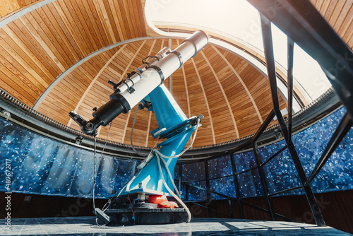A professional telescope in a space observatory with automatic bearing and platform rotation mechanisms photo