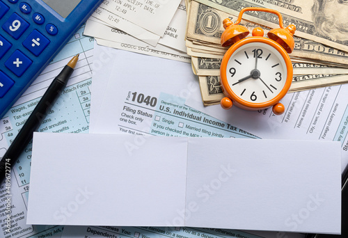 Tax forms 1040. U.S Individual Income Tax Return with other stationeries. photo