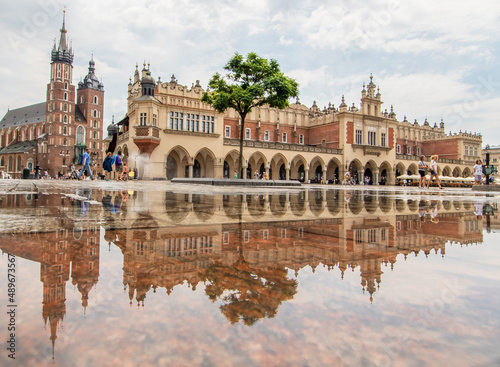 Krakow, Poland - frequent rainshowers make Old Town Krakow look like a mirror when it's full wet. Here in particular Market Square, a main landmark 