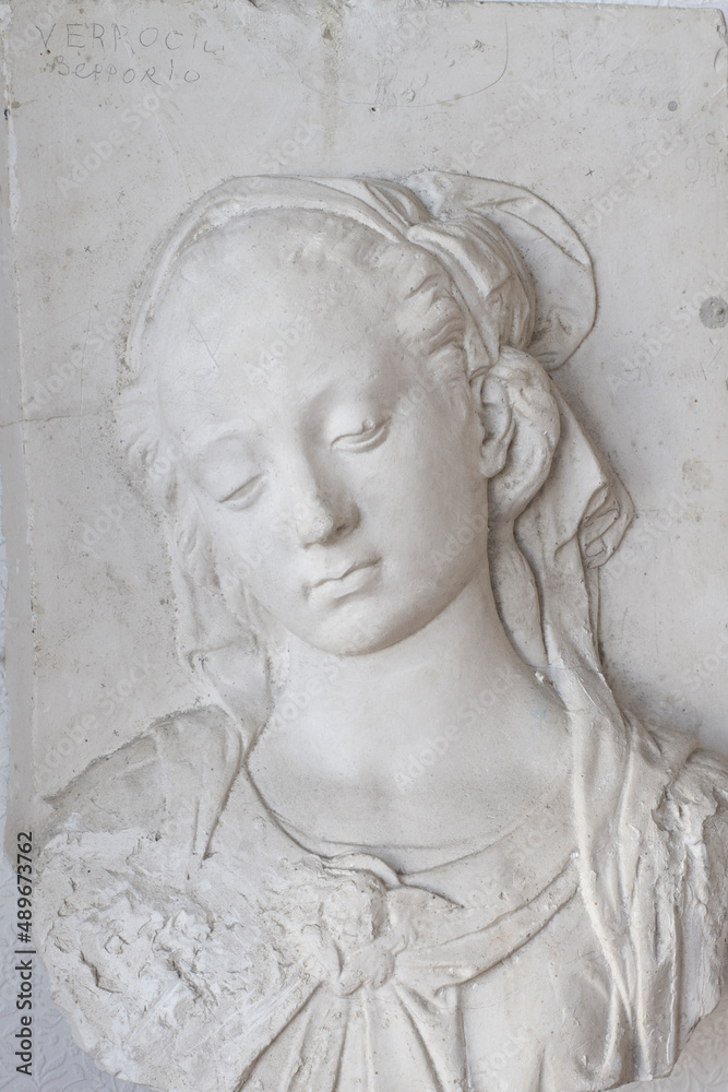 Bust of a girl - bas-relief, plaster model, cast, object for drawing. The study of human anatomy. Model for drawing from nature. Drawing lessons, academic drawing.