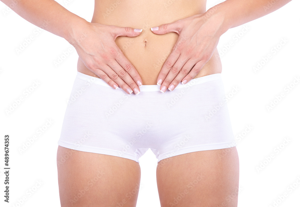 Nothing to worry about. Cropped studio shot of a woman measuring her waistline isolated on white.