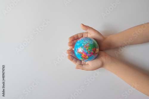 boy holding globe, globe in palm.Earth and energy concept. empty space for text.top view.