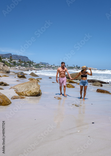 Clifton beach Cape Town South Africa, white sandy beach in Cape Town Clifton. Couple man and woman on the beach photo