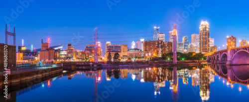  Minneapolis skyline with reflection in river at night.