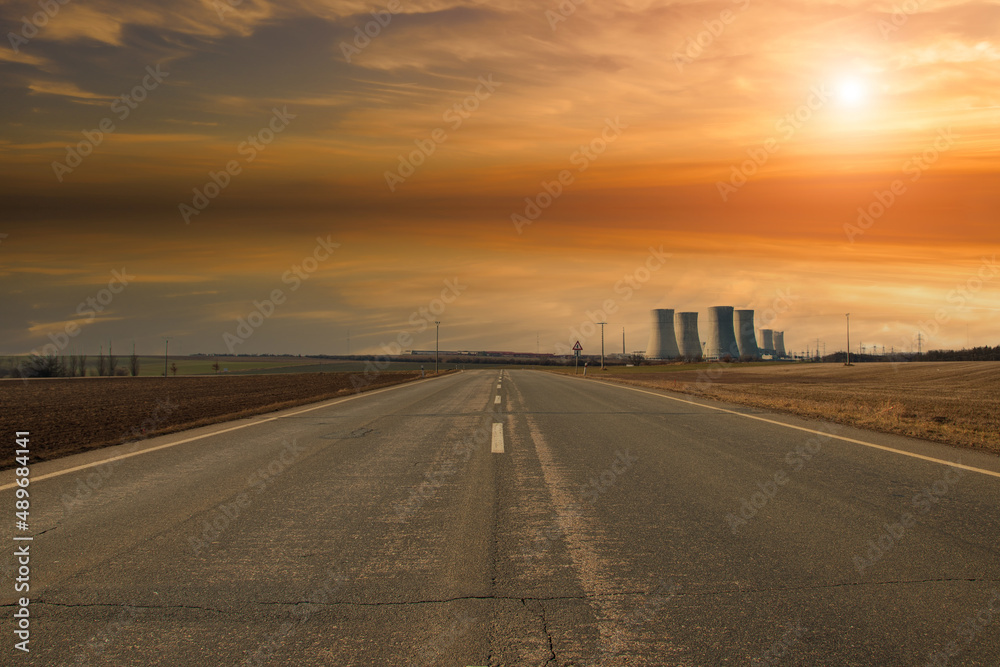 Dukovany Nuclear Power Plant in the Czech Republic, Europe. Smoke cooling towers. There are clouds in the sky. In the background the nature of the Highlands. Dukovany Nuclear Power Plant in the Czech Republic, Europe. Smoke cooling towers. There are clouds in the sky. In the background the nature of the Highlands.