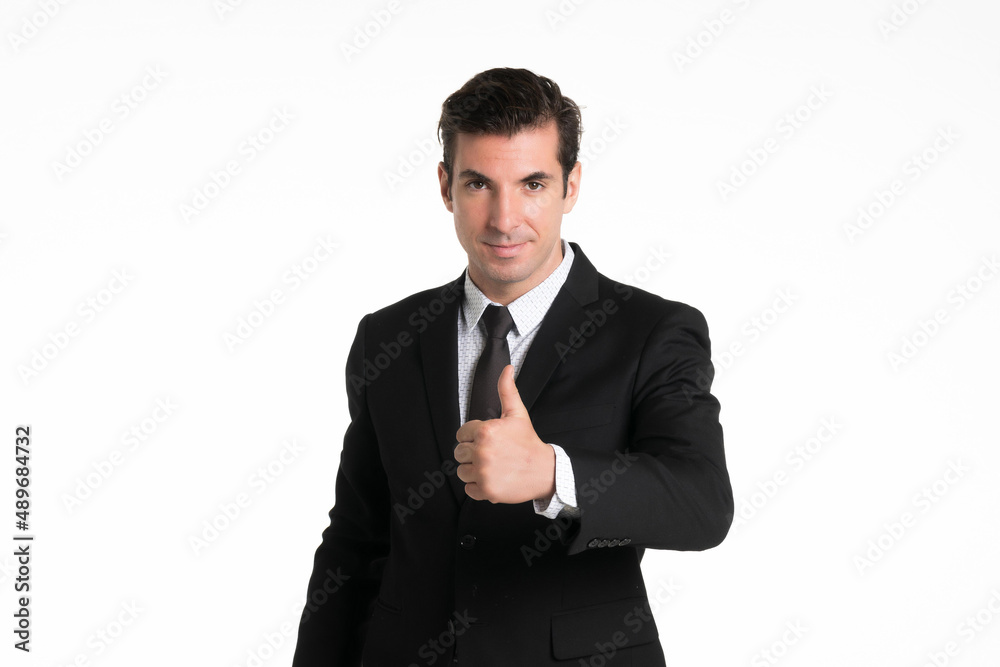 Portrait of a smiling western business man wearing a black suit with thumbs up at studio shot on white background. Portrait of a smiling western business man wearing a black suit with thumbs up at studio shot on white background.