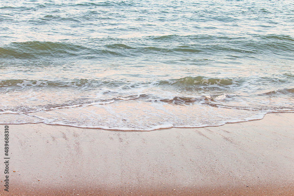 Small waves from the sea on a beautiful sandy beach. Small waves from the sea on a beautiful sandy beach.