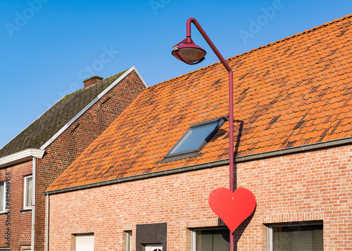 Building tiled roof and street light, Gavere, Belgium  photo